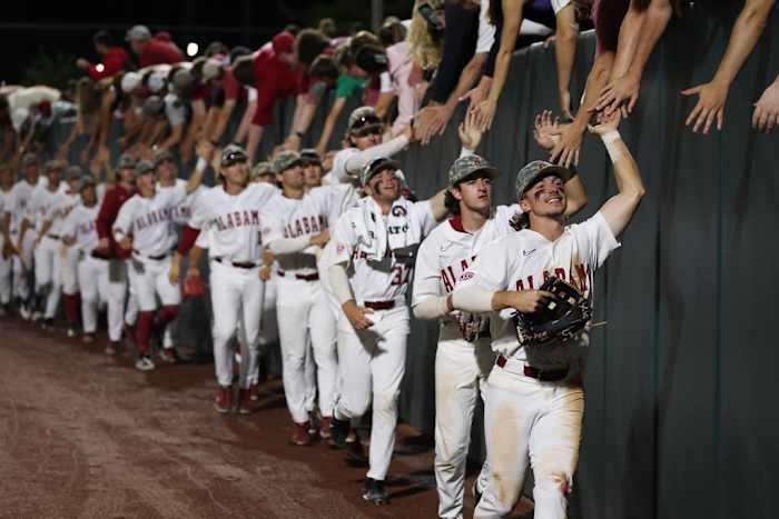 The University of Alabama Baseball Team celebrates with fans against Ole Miss at Sewell-Thomas Stadium in Tuscaloosa, AL on Thursday, May 18, 2023.